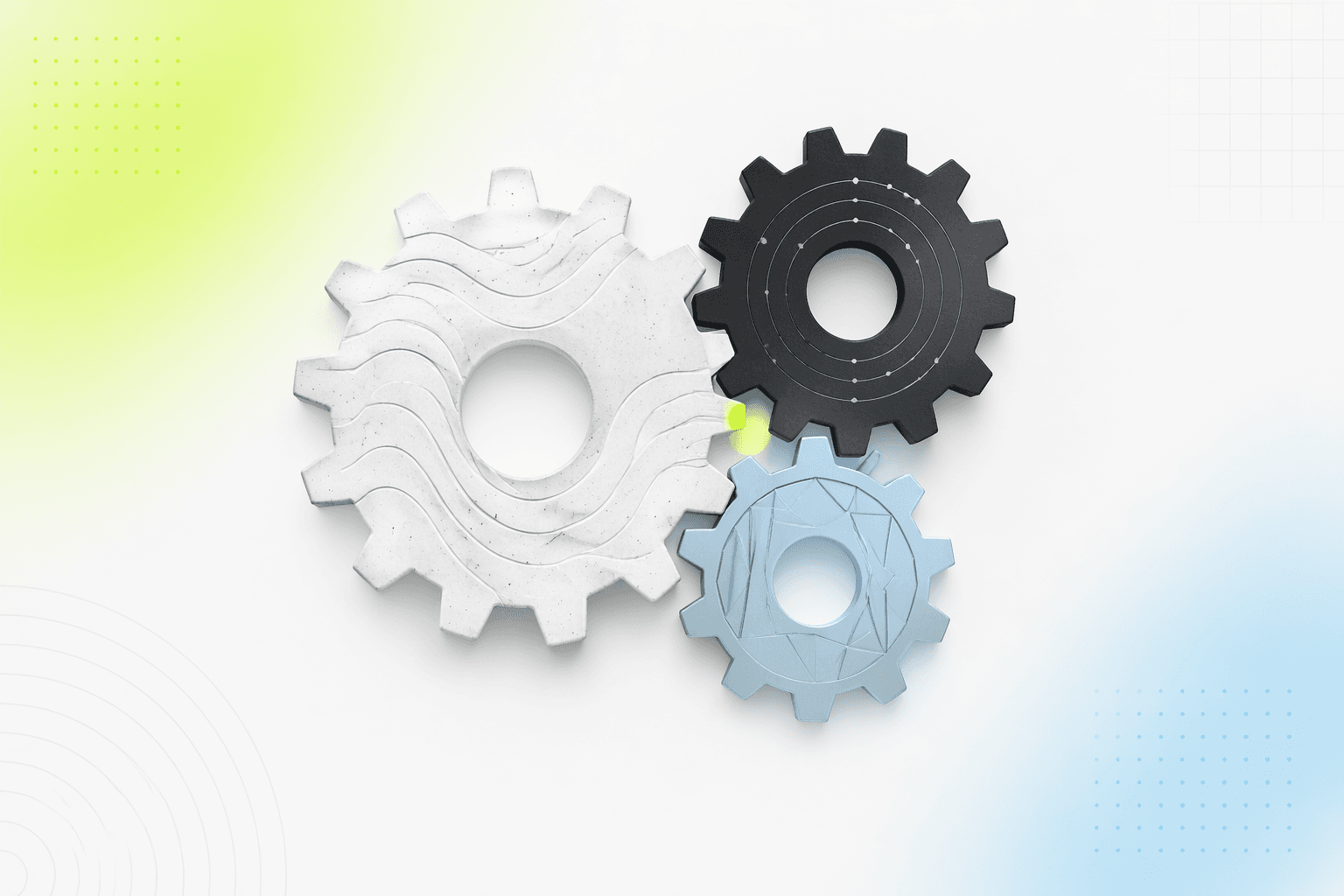 Three interlocking gears of different sizes meshing at a single point of contact